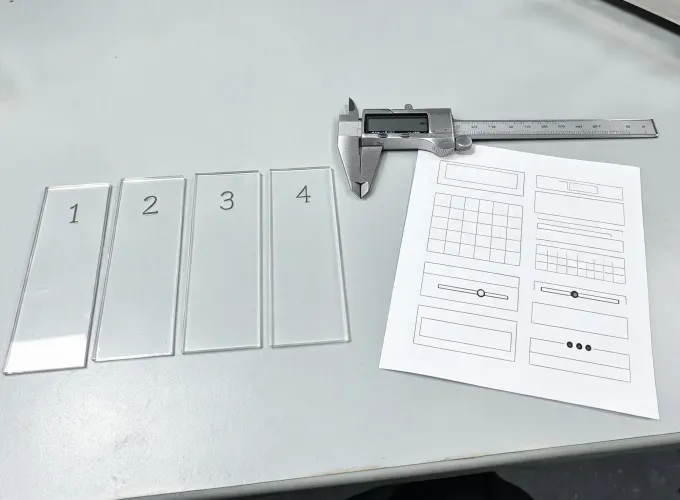 Acrylic test coupons arranged for inspection
